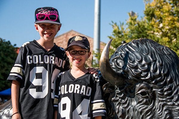 The famous Buffalo statue outside of Folsom Stadium draws the crowds for photo opportunities. (Photo Credit Travis Bildahl)