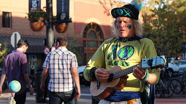 EARTH MAN jams out on the Mall singing songs that promote the planet.