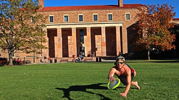 CU graduate Chad Alexander lays out for the catch in front on Norlin Quad. (Photo: Joseph Wirth)