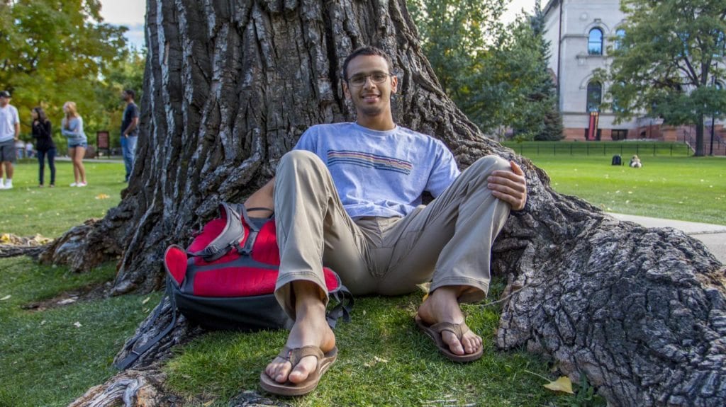 Senior Chemical Engineering major Aziz Alobaid from Kuwait hanging out a famous tree seat in Norlin Quad. He told me had never been to the U.S. before he came to CU and only saw pictures of the campus online before applying. (Photo: Joseph Wirth)