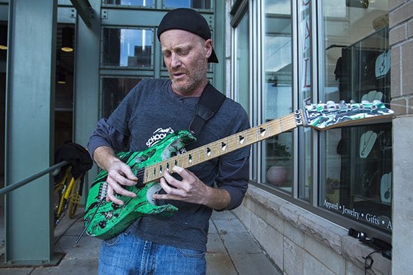 Local guitarist jams out on Pearl Street with the instrumentals to Carlos Santana's Black Magic Woman. (Photo: Joseph Wirth)