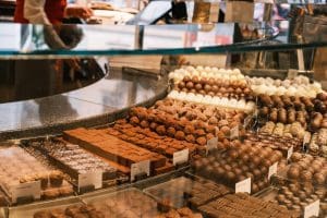 a display case filled with lots of different types of chocolates