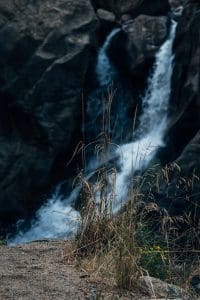 water falls on rocky mountain