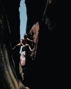 rule of thirds photography of man climbing mountain