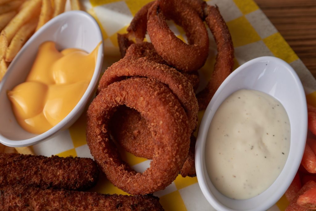 Close-up Photo of Fried Onion Rings with Dipping Sauce