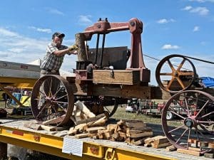 antique working steam powered log splitter at the yearly Yesteryears Farm Show on 287 in Boulder County