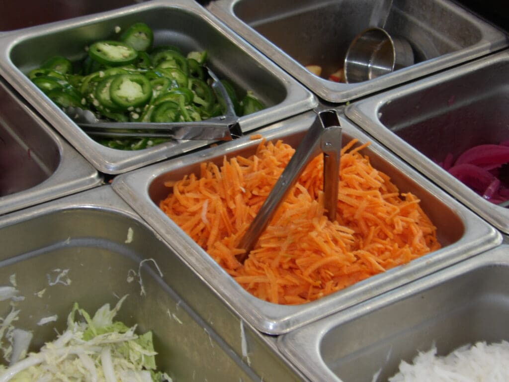 Food trays for prep, diagonal composition, carrots center