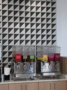 Boulder's Crisp & Green Rocks! Attention to detail with a patterned wall behind the beverage dispensers