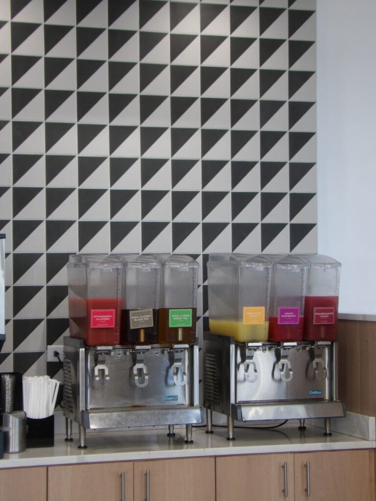 Boulder's Crisp & Green Rocks! Attention to detail with a patterned wall behind the beverage dispensers