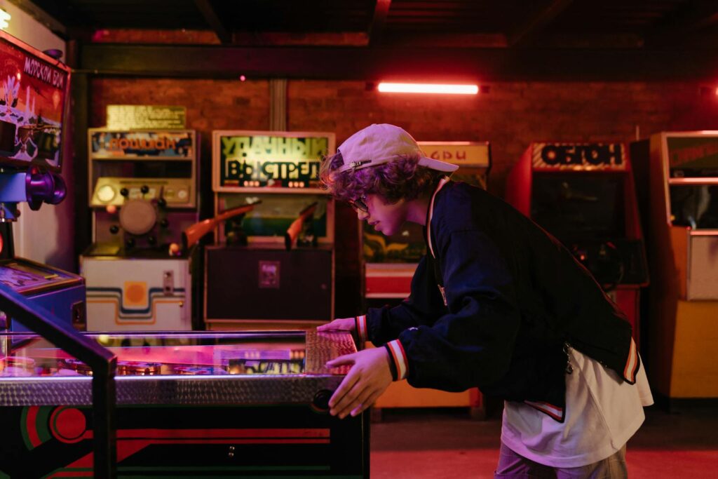 Man in black jacket and white trousers stands in front of the counter – AboutBoulder