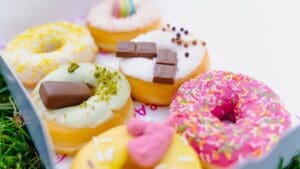 a box filled with lots of different flavored donuts