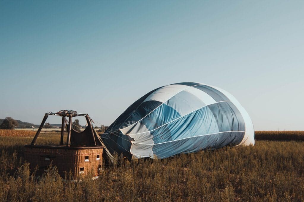 hot air balloon, balloon, sky, blue, nature, wind, blue sky, field, flight