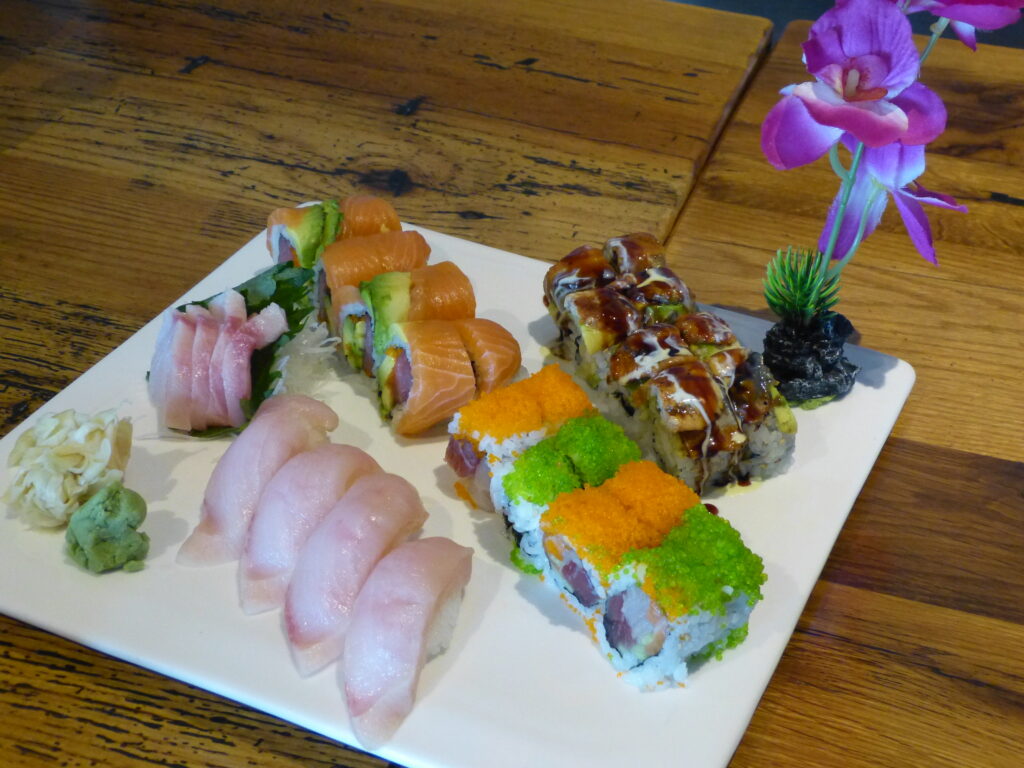 A large tray of assorted sushi