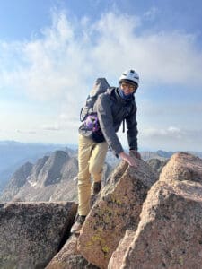 Reed summitting a 14er pic Amy Campbell