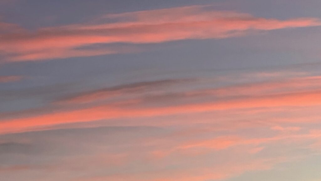 Blues showing the sun rising on the sky of the New Year