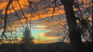 Blues, oranges, and burnt umber set against each other form the colorway as the sun first breaks through.