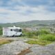 a white rv on a road