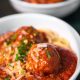 meta balls with noodles served on white ceramic bowl