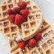 red strawberries on brown waffles
