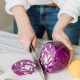 woman slicing purple vegetable